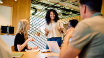 A manager leading an open team discussion to build trust during organisational change.